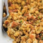 Baked Italian-Inspired sausage stuffing in baking dish.