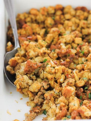 Baked Italian-Inspired sausage stuffing in baking dish.