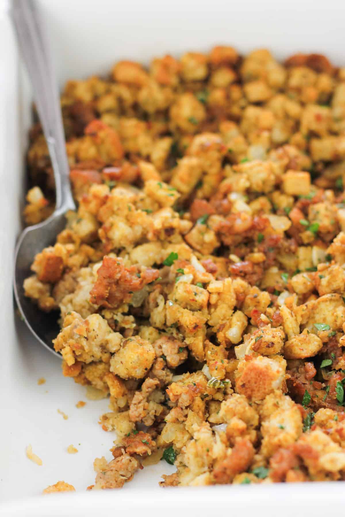 Baked Italian-Inspired sausage stuffing in baking dish.