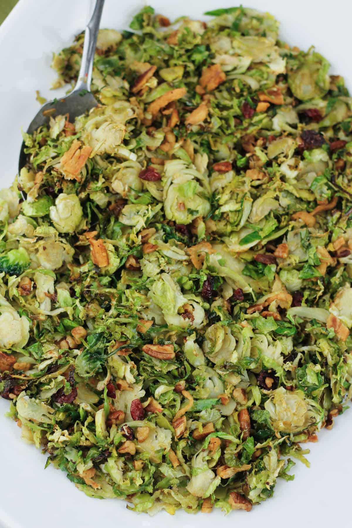 Overhead shot of roasted brussels sprouts on a serving platter.