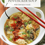 Overhead shot of super easy potsticker soup garnished with sesame seeds and spicy chili onion crunch.