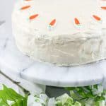 ced carrot cake with carrot decorations.