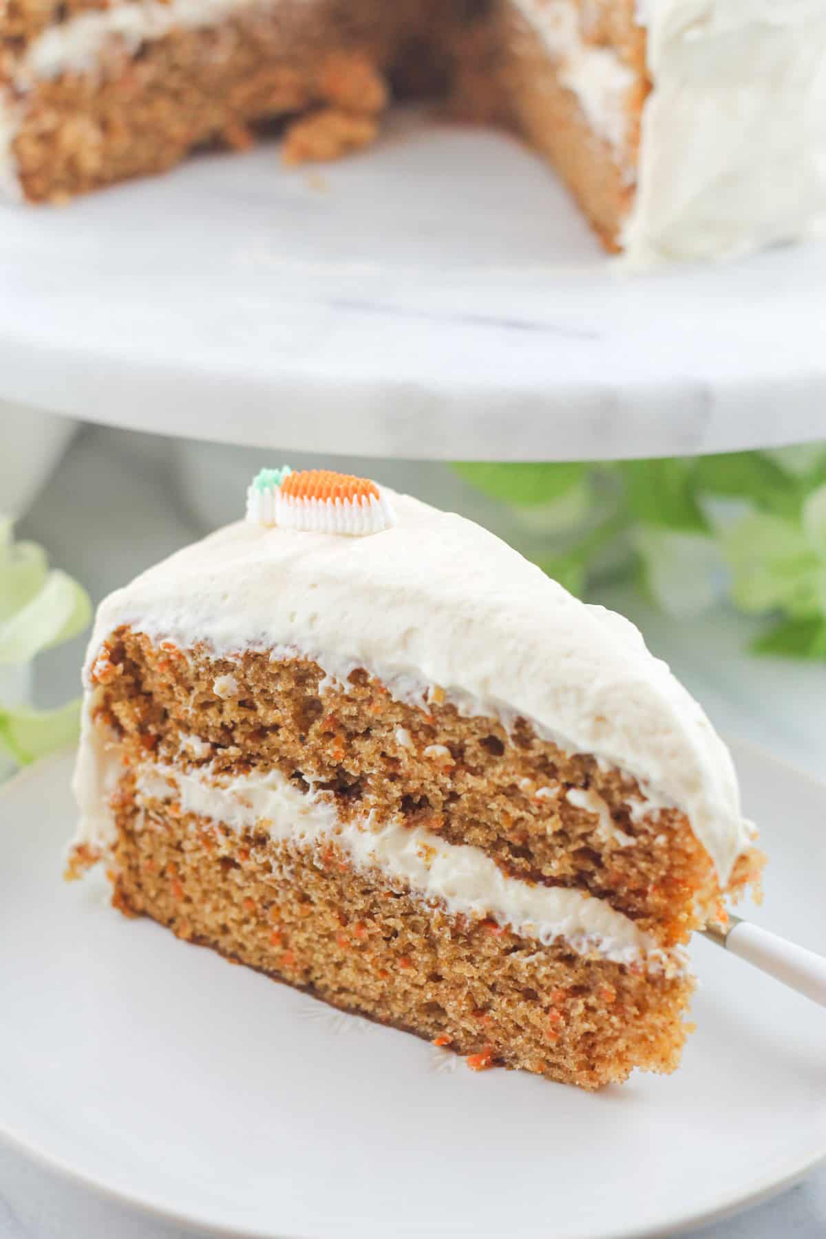 Super moist standing sliced two layer carrot cake.