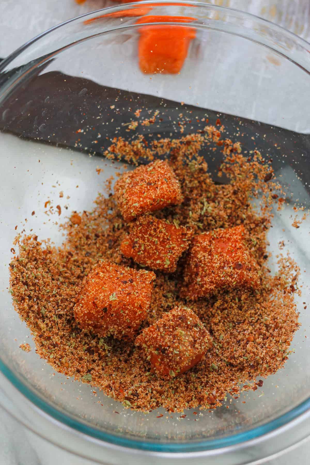 Cubed salmon tossed in spice and herb mixture.