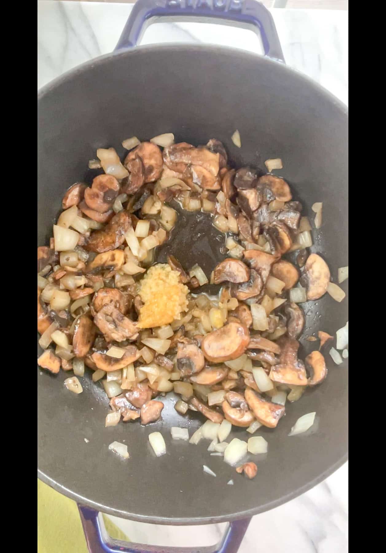 Garlic and ginger added to sauteed onions and mushrooms.