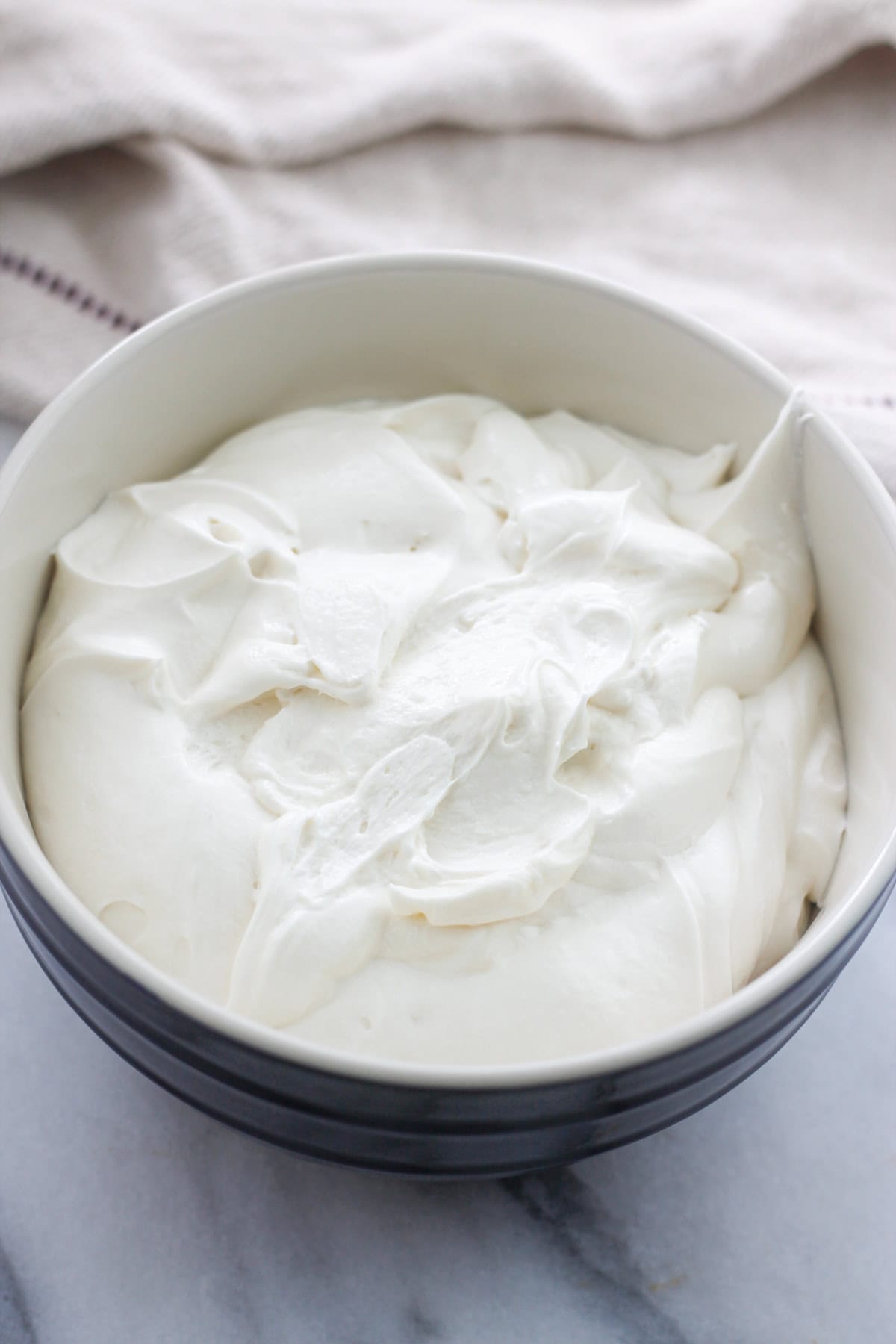 Bowl of cream cheese frosting.