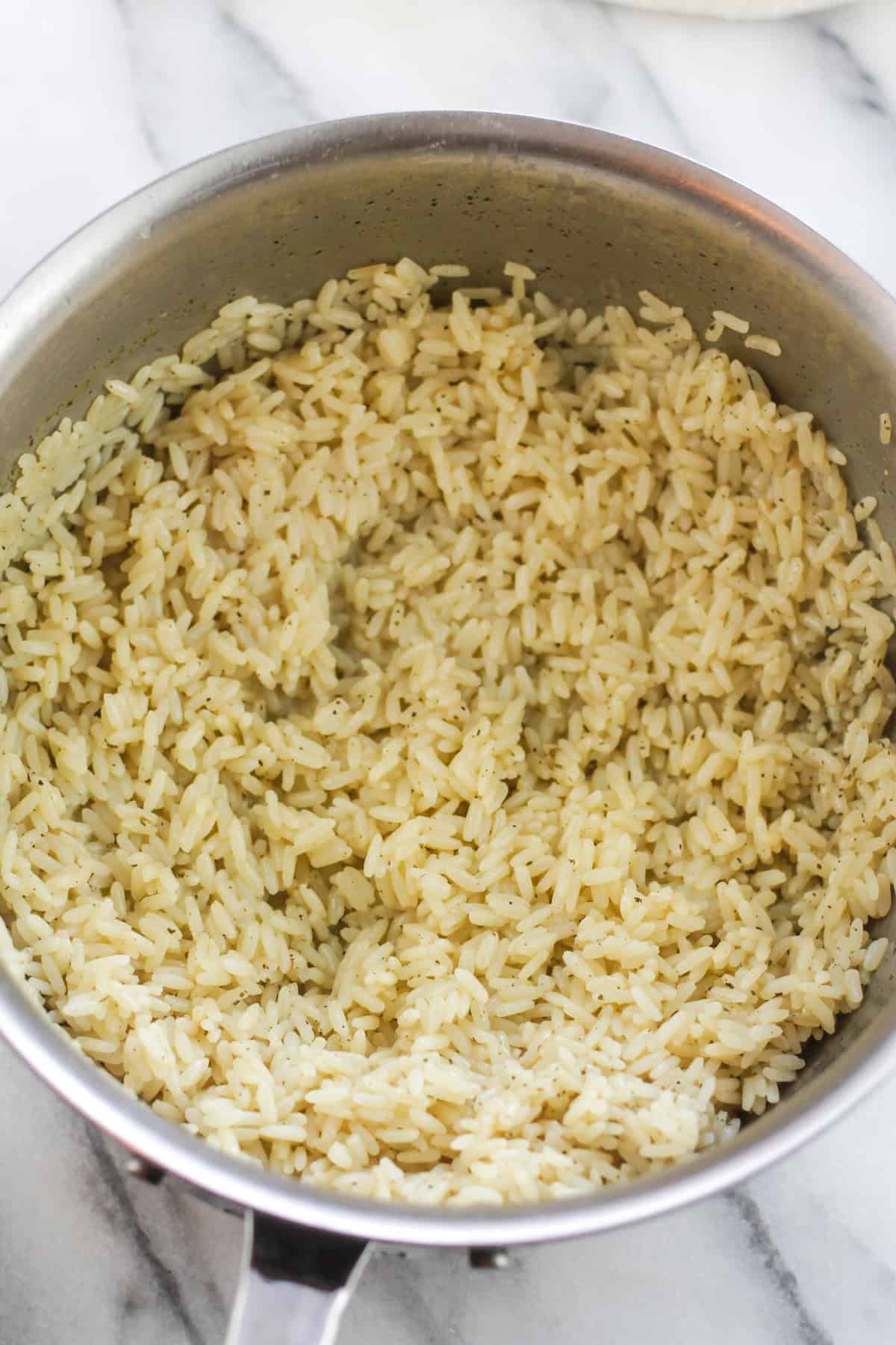 Saucepan with prepared cilantro lime rice.