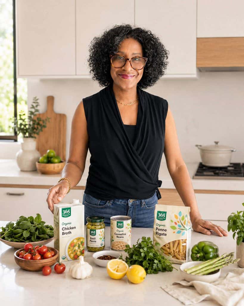 Celeste standing at kitchen counter with fresh and store purchased ingredients on the counter.