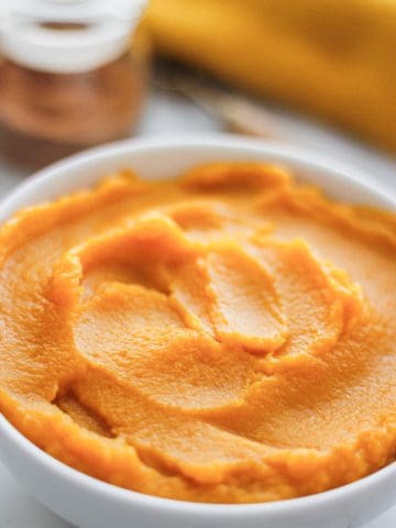Bowl filled with homemade pumpkin puree.