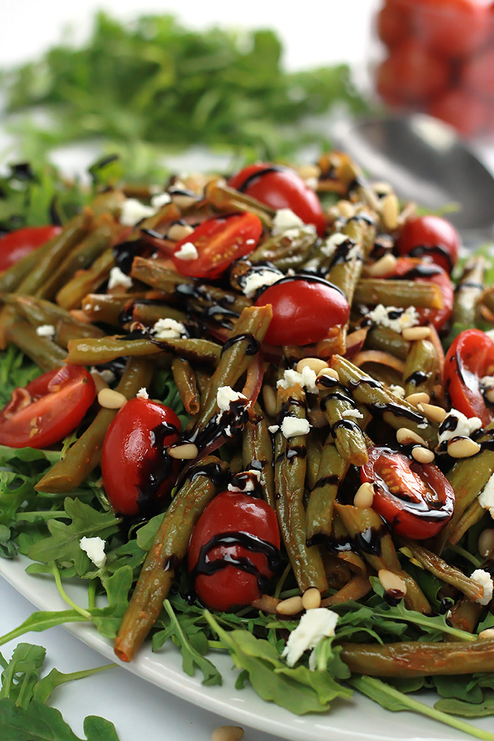 Put some spice in your summer with this Spicy Green Bean Salad, filled with tender-crisp green beans, juicy cherry tomatoes, wrapped in garlic and spice of sriracha. 